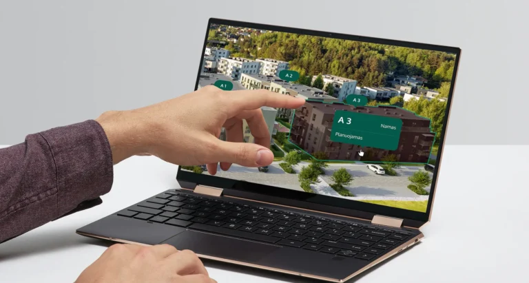Laptop showing the clickable neighborhood view of Bajorų alėjos, with an info box for building A3